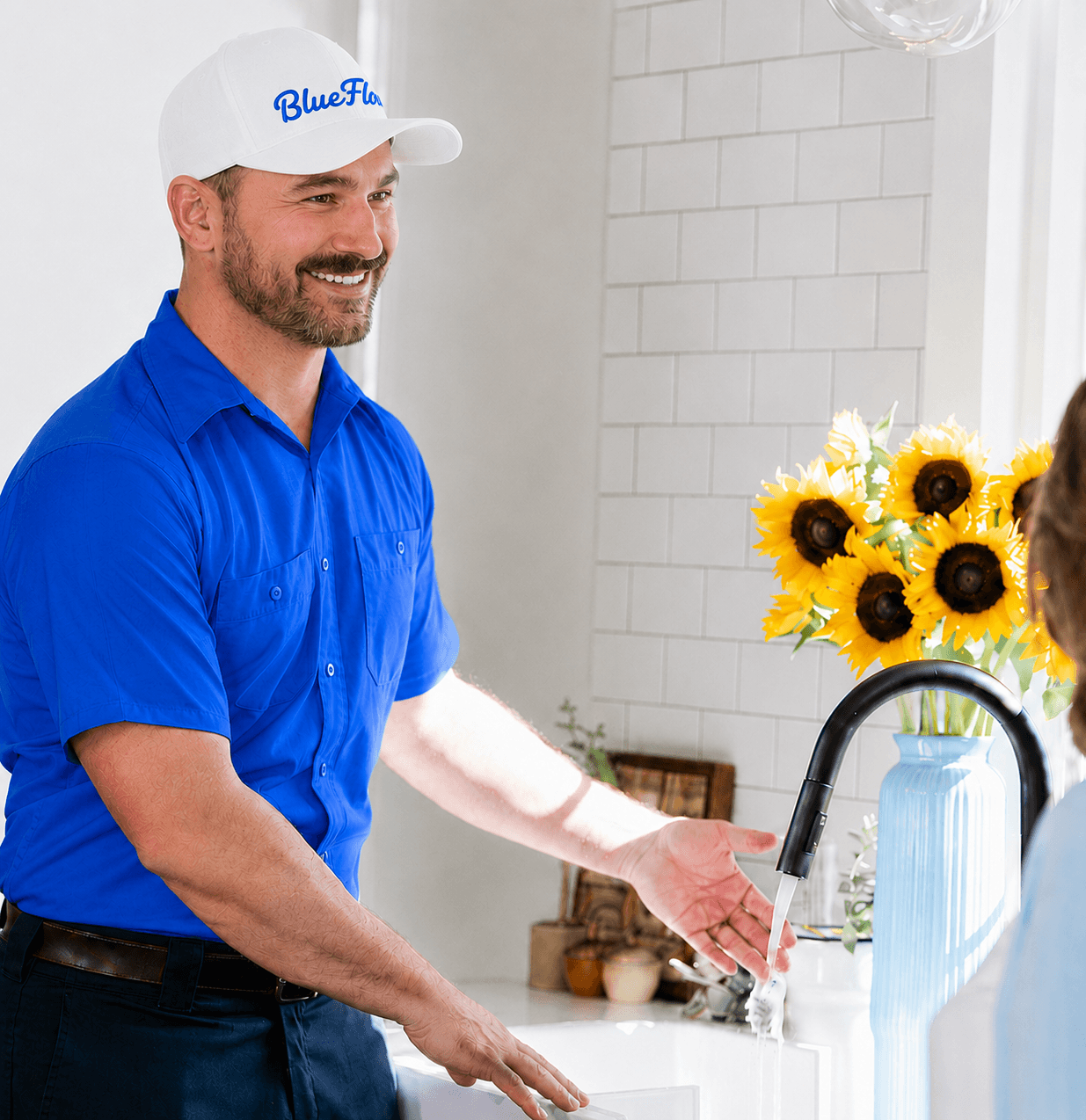 Blue Flow plumber on the job